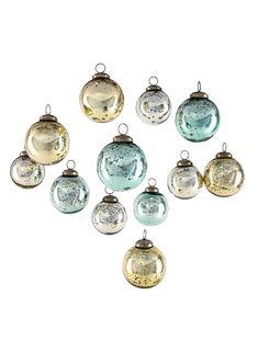 an assortment of glass ornaments hanging from strings