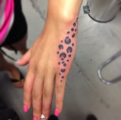 a woman's hand with a tattoo on it