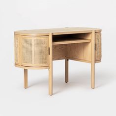 a wooden desk with an open drawer on the top and bottom section, in front of a white background