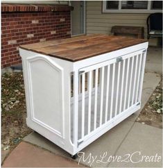 a white crib sitting in front of a house