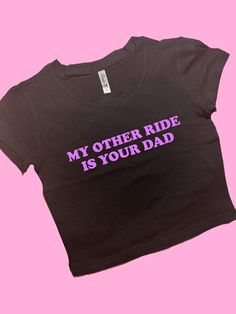 My Other Ride Is Your Dad SNUG FIT Crop Top | Cute Crop Top | Graphic Top | Gift For Her | Y2K crop top | Gift for friend | Y2K Baby Tee Comfy Top to Lounge in! Actual item may be lighter/darker than pictured. M A T E R I A L S - SNUG FIT - 100% RING SPUN COTTON - Shoulder Taping S I Z I N G - Size chart is available on our listing photos. S H I P P I N G  &  P R O D U C T I O N  T I M E - Production Time is 5 Business Days. (May be delayed during the Holiday Season) - Shipping Time is 2-6 Busin Black Fitted Crop Top With Slogan, Trendy Purple Cotton Crop Top, Custom Text Fitted Summer Tops, Summer Fitted Tops With Custom Text, Fitted Summer Tops With Custom Text, Black Custom Text Tops For Summer, Custom Text Black Summer Tops, Y2k Crop Top, Cute Crop Top