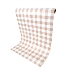 a brown and white checkered table cloth hanging from a metal hook on a wall