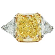 Magnificent Platinum & 18K Yellow Gold Engagement Ring, set in the center with Fancy Yellow 7.49C. VVS1 Cushion cut Diamond, GIA certified, flanked by two triangles Diamonds weight 1.38C. F color VS1 clarity. Total weight of the Diamonds is 8.87C. Yellow Gold Engagement Ring Set, Gold Engagement Ring Set, Cushion Cut Diamond Engagement Ring, Triangle Diamond, Yellow Gold Engagement Ring, Cushion Cut Diamond, Yellow Gold Engagement, Yellow Gold Engagement Rings, Cushion Cut Diamonds