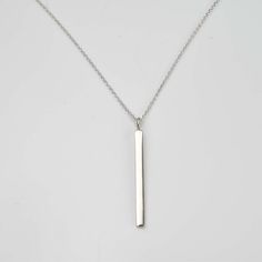 Personalize your style with the Engravable Silver Bar Necklace ✨💖! This elegant accessory features a sleek silver bar that can be customized with your special message or date. 💫 Perfect for any occasion, its minimalist design complements any outfit with modern flair. Crafted with high-quality materials for durability, the adjustable chain ensures a comfortable fit. 💕 Treat yourself or a loved one to this timeless accessory that will be cherished for years to come! 💖 Simple Silver Necklace With Rectangular Pendant, Minimalist Silver Bar Necklace As Gift, Modern Sterling Silver Bar Necklace As Gift, Minimalist Engraved Silver Bar Necklace, Classic Silver Bar Necklace As A Gift, Modern Sterling Silver Bar Necklace For Gift, Minimalist Silver Engraved Bar Necklace, Silver Minimalist Bar Necklace For Personalized Gift, Modern Sterling Silver Bar Necklace