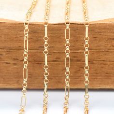 Gold Figaro Chain Necklace With Rectangular Links, Gold Chain Necklace With Rectangular Rolo Links, Gold Rolo Chain Necklace With Rectangular Links, Elegant Gold-plated Chain Necklace With Rectangular Links, 14k Gold-filled Delicate Link Chain Necklace, Long Gold-tone Brass Chain Necklace, 14k Gold Chain Necklace, 16 Inch Length, Gold-tone Chain Link Brass Necklaces, Figaro Chains