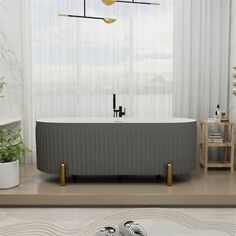 a bathroom with a bathtub, sink and toilet in it's center area