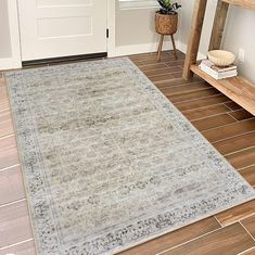 a rug on the floor in front of a door