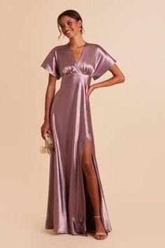 This kimono sleeve satin bridesmaid dress is so elegant, but you have to see it in action to understand its jaw-dropping effect. And don't underestimate its demure coverage either—though the sleeves and floor-length skirt keep you looking modest, the slit and deep V-neck show the perfect peek of skin. Just get ready for the oohs and aahs. Jesse Shiny Satin Dress - Dark Mauve Mauve Bridesmaid, Mauve Bridesmaid Dress, Satin Gowns, Satin Bridesmaid Dress, Dark Mauve, Birdy Grey, Purple Bridesmaids, Purple Bridesmaid Dresses, Satin Kimono