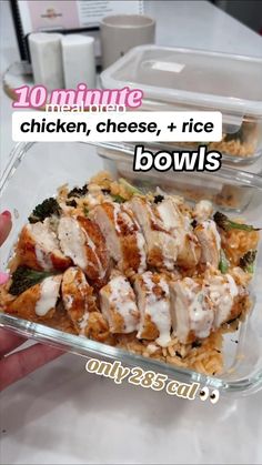 chicken, cheese, and rice bowls in plastic containers