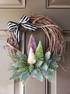 a wreath is hanging on the front door