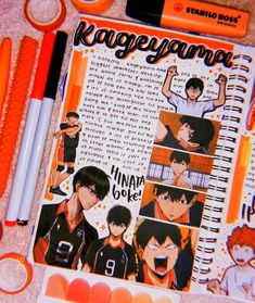 an open notebook with anime characters on it next to markers, pens and pencils