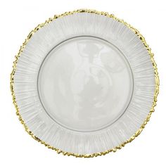 a white plate with gold trimmings on the edge and bottom, sitting in front of a white background