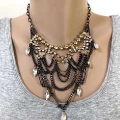 Mixed Metal Bib-Style Necklace Features Antiqued Gold Chatons, Dangling Clear Crystals And Black Gunmetal Chains. Measures 16 Inches With A Three Inch Extender And Lobster Clasp. Collection Piece That Sure To Wow When Paired With Formal Attire. Never Worn. Costume Jewelry Metal Layered Necklace For Party, Party Costume Jewelry Layered Necklace In Metal, Black Metal Rhinestone Necklace With Chain, Black Metal Rhinestone Necklace For Party, Party Bib Necklace With Chain, Party Black Rhinestone Metal Necklace, Elegant Black Layered Necklace For Party, Diy Statement Necklace, 16 Inch Necklace