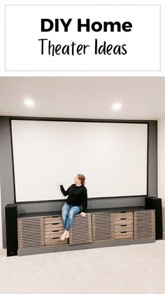 a woman sitting in front of a projector screen with the words diy home theater ideas