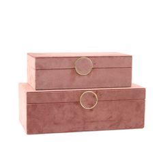 two pink velvet boxes with gold rings on the top and bottom, sitting side by side