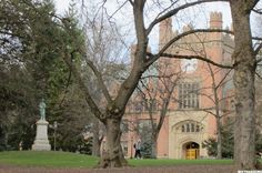 an old building with trees in front of it