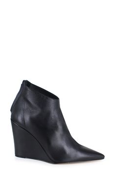 A rich leather upper and streamlined silhouette lend luxe appeal to a striking bootie framed by a pointy toe and wrapped wedge heel. 4" heel 4" shaft Leather upper, lining and sole Made in Italy Wedge Heels, Bootie, Leather Upper, Black Leather, Wedges, Nordstrom, Italy, Heels, Leather