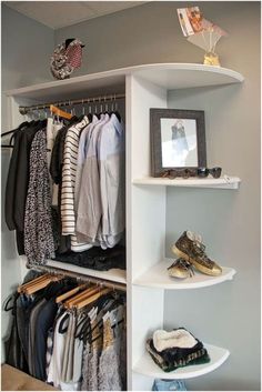 an organized closet with clothes and shoes