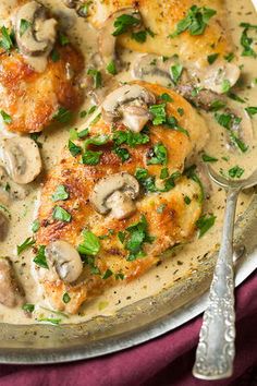 a pan filled with chicken covered in mushrooms