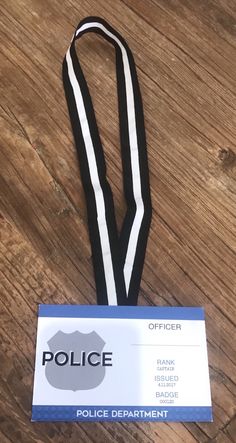 a police lanyard with a badge attached to it