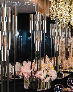 the centerpieces are arranged in glass vases