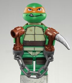 an image of a lego ninja turtle with chains on it's back and the text ebay $ 79 99