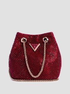 Rhinestone mesh pouch Shiny gold-tone hardware Enameled triangle logo Multiple interior pockets Chain drawstring closure Top handle with 2.75" drop. Detachable shoulder strap with 23.5" drop. 7"W x 4.25"H x 2.25"D Pretty Purses, Mesh Pouch, Guess Handbags, Handbag Heaven, Looks Black, Triangle Logo, 2024 Vision, Cute Bags, Holiday Outfits