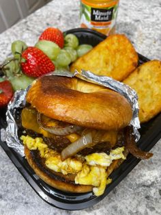 a sandwich and some fruit on a table