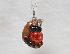 IMPORTANT: Due to a surge in holiday orders I currently have a 2-3 week waiting period for all orders before I can ship them. Please take this into account before ordering as unfortunately I am not able to ensure delivery of an item before 2-3 weeks. I am very sorry for any trouble. ----------------------------- A perfect gift for yourself or the red panda lover in your life! This dashing double sided red panda was hand sculpted from polymer clay, painted with acrylic paints and metallic rub, th Red Resin Novelty Jewelry, Novelty Red Resin Jewelry, Orange Novelty Jewelry For Gifts, Orange Novelty Jewelry For Gift, Novelty Orange Jewelry For Gift, Red Polymer Clay Necklace For Gift, Panda Necklace, Wear Black Dresses, Ladybug Funny