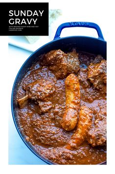 a pan filled with meat and sauce on top of a table