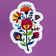 a colorful flower sticker on a purple background