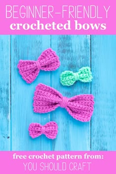 three crocheted bow ties sitting on top of a blue wooden table next to each other