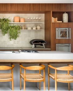 the kitchen counter is clean and ready to be used as a dining room table with four chairs