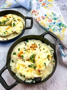 two cast iron skillets filled with mashed potatoes