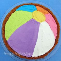 there is a cake with different colored frosting on it