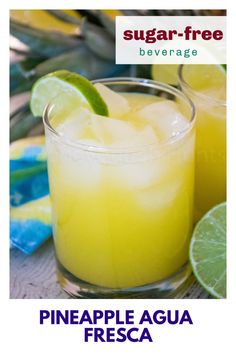 two glasses filled with pineapple agua fresca on top of a table