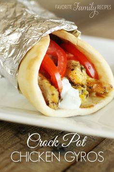 chicken gyros wrapped in foil on a white plate with the title overlay