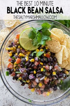 the best 10 minute black bean salsa in a glass bowl with tortilla chips