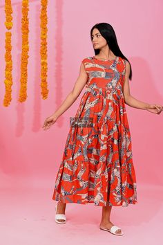 Summer Sleeveless Dress With Printed Motifs, Summer Cotton Maxi Dress With Kalamkari Print, Sleeveless Summer Dress With Printed Motifs, Red Cotton Sleeveless Vacation Dress, Sleeveless Cotton Maxi Dress With Block Print, Orange Sleeveless Cotton Maxi Dress, Sleeveless Orange Cotton Maxi Dress, Summer Cotton Maxi Dress With Ikat Print, Cotton Maxi Dress With Ikat Print For Summer