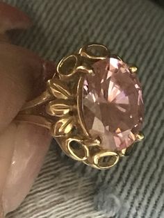 GORGEOUS VINTAGE 14K YELLOW GOLD LARGE PINK STONE RING Very pretty ring crafted of solid 14K Yellow Gold! Band a little bent but does not affect wear. Large pink stone solitaire, 13mm x 11mm Weighs 5.4 grams total. Size 6.25 Shipped with insurance. Formal Pink Gold Ring With Center Stone, Hallmarked Gold Oval Topaz Ring, Hallmarked Oval Gold Topaz Ring, Gold Oval Hallmarked Topaz Ring, Gold Oval Topaz Ring, Hallmarked, Oval Gold Topaz Ring With Diamond Cut, Pink Gold Rings For Formal Occasions, Formal Pink Gold Round Rings, Antique Gold Topaz Ring With Center Stone