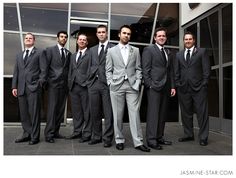 a group of men in suits standing next to each other