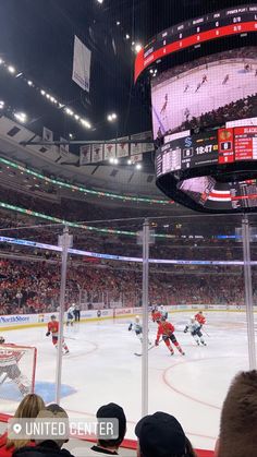 an ice hockey game is being played at the united center