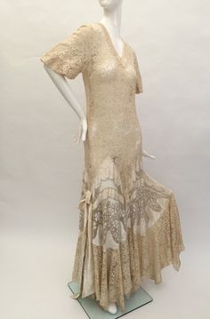 Antique Style Fitted Wedding Dress, Fitted Vintage-inspired Wedding Dress, Fitted Bohemian Lace Dress For Evening, 1920s Fitted Lace Dress, Beige Lace Evening Dress, Floor-length Lace Dress For Vintage Events, Cream Dresses With Bias Cut For Vintage Events, Elegant Bias Cut Dress For Vintage Events, 1920s Fitted Beige Dress