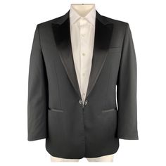 VIKTOR & ROLF single breasted tuxedo sport coat comes in black wool with a satin peak lapel and mirrored single button tab front and functional button cuff sleeves. Very minor wear on buttons. Made in Italy. Excellent Pre-Owned Condition. Marked: IT 52 Measurements: Shoulder: 17 inches Chest: 40 inches Sleeve: 24 inches Length: 31 inches Reference: 97922 Category: Sport Coat More Details Brand: VIKTOR & ROLF Size: 42 Chest Size: 42 Color: Black Pattern: Solid Fabric: Wool Style: Peak Lapel Made in: Italy Age Group: Adult Gender: Male Classic Single Button Tuxedo For Formal Events, Single Breasted Tuxedo For Formal Occasions, Single-breasted Tuxedo For Formal Occasions, Luxury Single Button Formal Blazer, Classic Evening Single-breasted Suit, Classic Formal Tuxedo With Hidden Button Closure, Classic Single Button Tuxedo For Semi-formal Occasions, Evening Tuxedo Blazer With Pressed Crease, Classic Single-breasted Tuxedo For Black Tie