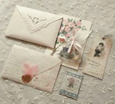 some old fashioned envelopes are laying on a table