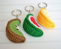 three crocheted keychains with two different fruits on them