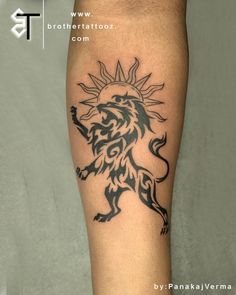 a man with a tattoo on his leg that has a lion and sun in it