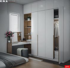 a bedroom with a bed, desk and closets in the corner next to a window