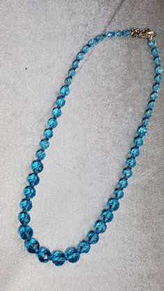 The beautiful quality of the necklace is evident in the materials. Czech Fire Polished beads, Swarovski crystals, and silver plated secure clasp. Love the intense aqua! Elegant Faceted Turquoise Beaded Necklace, Formal Blue Faceted Necklaces, Formal Blue Faceted Necklace, Blue Gemstone Beads Necklaces For Party, Blue Gemstone Beads Necklace For Party, Party Crystal Necklaces With Faceted Beads, Faceted Crystal Round Necklaces For Party, Faceted Beads Crystal Necklace For Party, Faceted Crystal Necklaces For Party