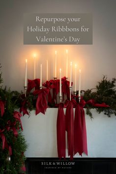 a fireplace with candles and red bows on the mantle for valentine's day written in white